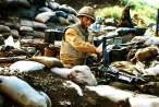 U.S. Marine tending to his Machine Gun. He is dug in with the Marines in the trenches surrounding Con Thien, September 25, 1967..jpg