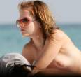 mena_suvari-beach_topless_04.jpg