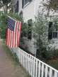 468732-FB~American-Flag-Hanging-Outside-of-House-MA-Posters.jpg